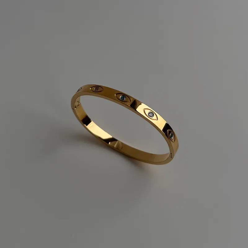 Bracelet doré œil brillant
