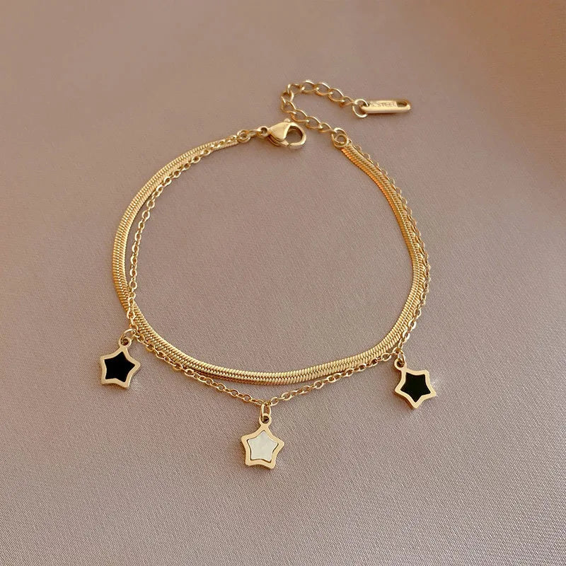 Bracelet doré pendentifs étoile