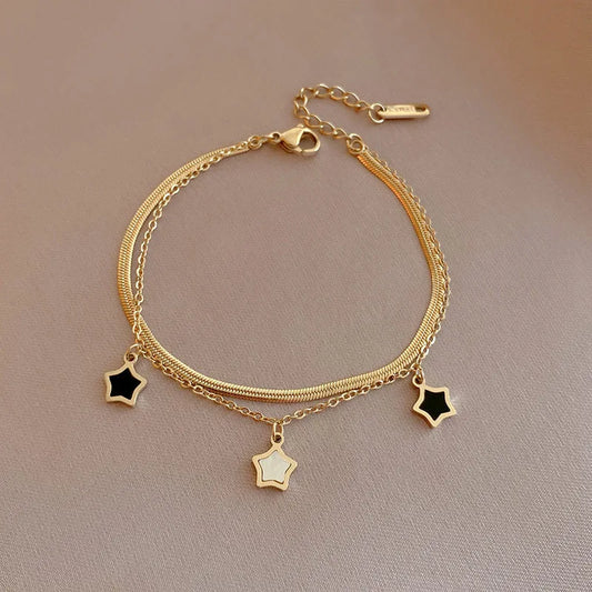 Bracelet doré pendentifs étoile