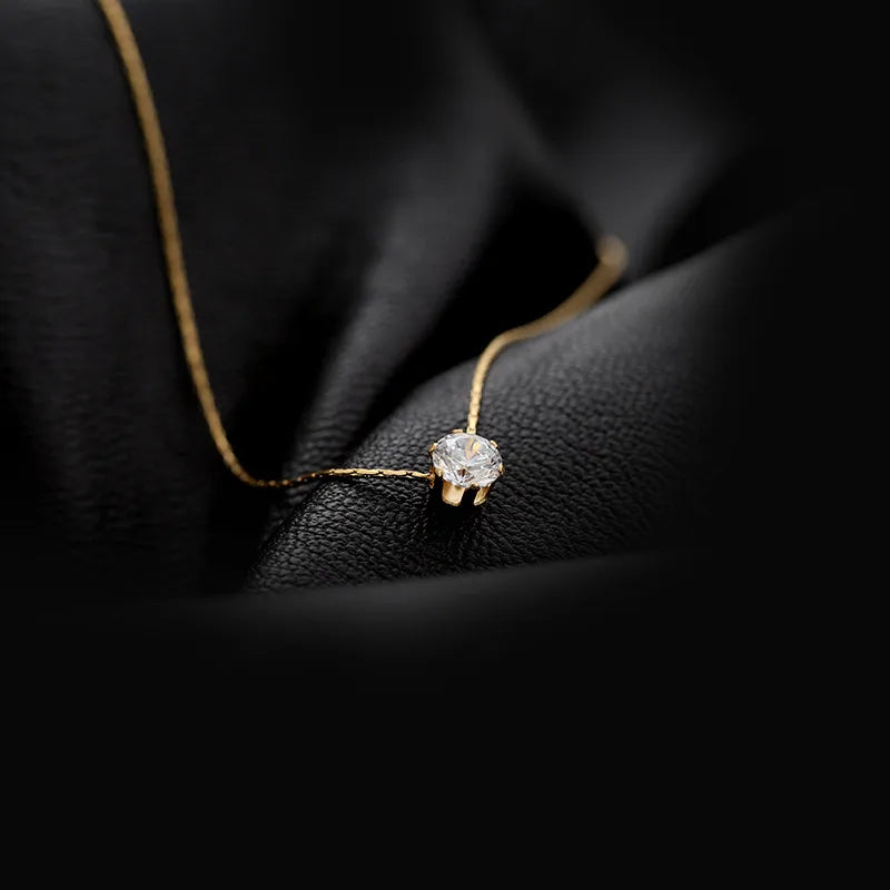 Collier doré pendentif brillant